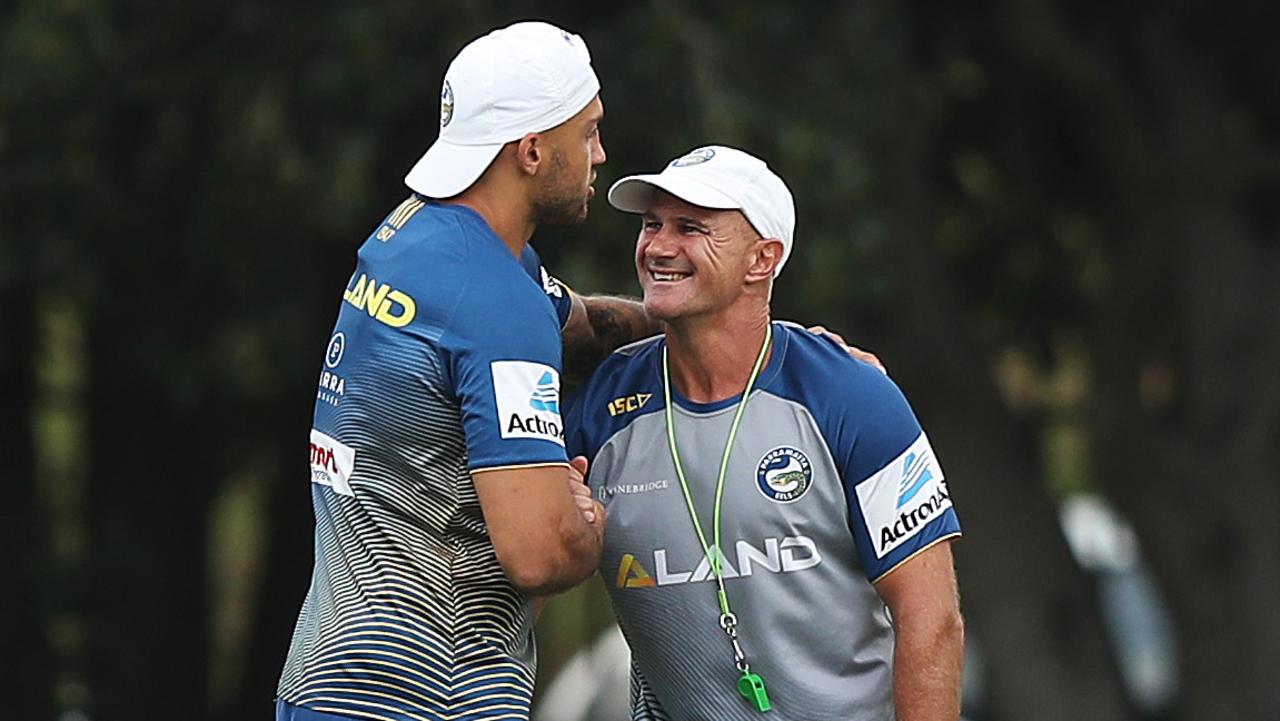 Blake Ferguson gets a hug from coach Brad Arthur during Parramatta training.