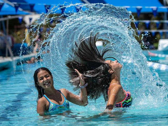 Waves Aquatic Centre had a record number of visitors over December. Sisters Marissa Verviris, 11, and Renee Verviris, 15, (right) enjoy Waves Pool at Baulkham Hills. Picture: Julian Andrews