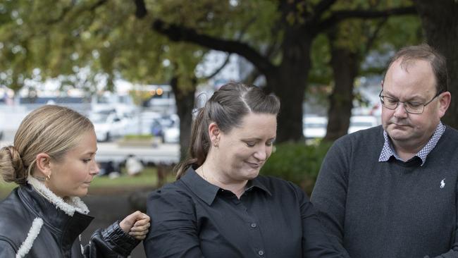 Grace Tame, Katrina Munting and her husband Danny Munting at Parliament lawns, Hobart. Picture: Chris Kidd