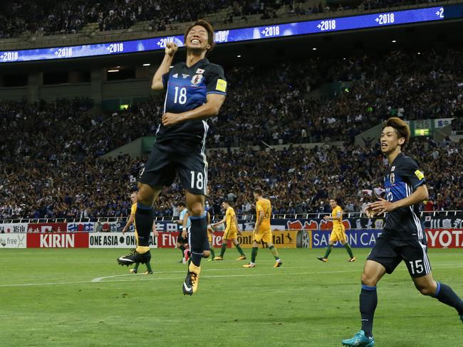 Takuma Asano celebrates scoring Japan’s opening goal.