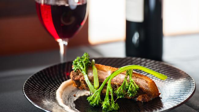 Nero Dining’s pork belly with white bean puree and broccolini.