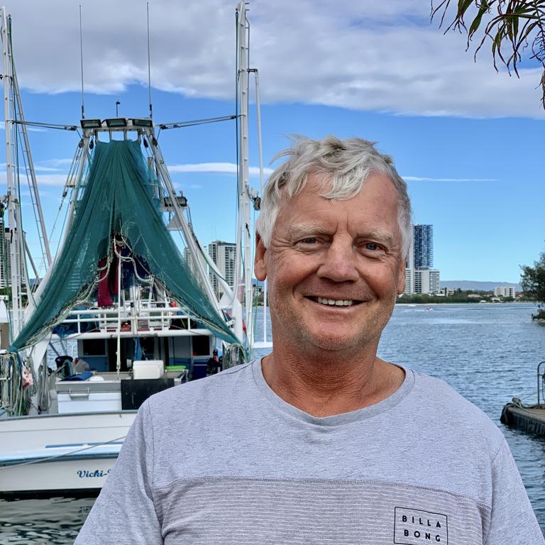 Local Brian Scholer waiting for the Trawlers to come in at Main Beach. Picture: JENNY MASTERS