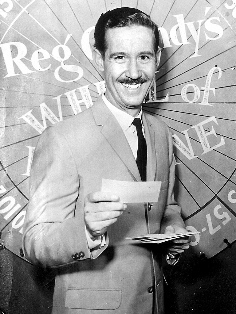 Grundy started as a boxing and general sports commentator for radio station 2SM Sydney in 1947. While at 2CH Sydney in 1957, he devised and hosted the Wheel of Fortune game show on radio, moving with that show to television, starting on Channel 9 in 1959. He is on the set of Wheel Of Fortune here in 1959