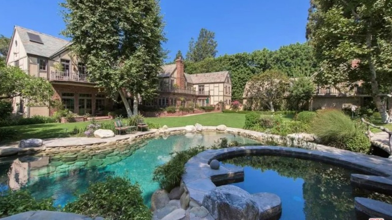 The estate contains a koi pond, a lagoon-like pool and a spa. Picture: Realtor.com