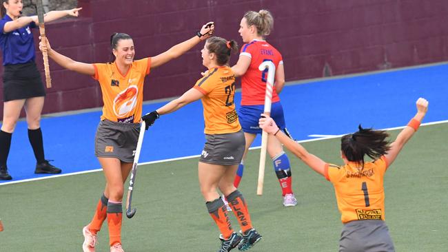 Kendra Fitzpatrick (left) of the Blaze celebrates with team mate Britt Wilkinson (centre) after scoring a goal. (AAP Image/Darren England)