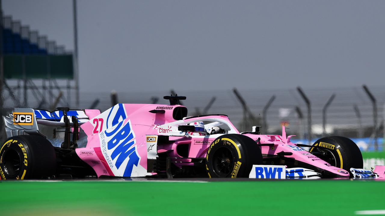 Nico Hulkenberg in the pink Mercedes.