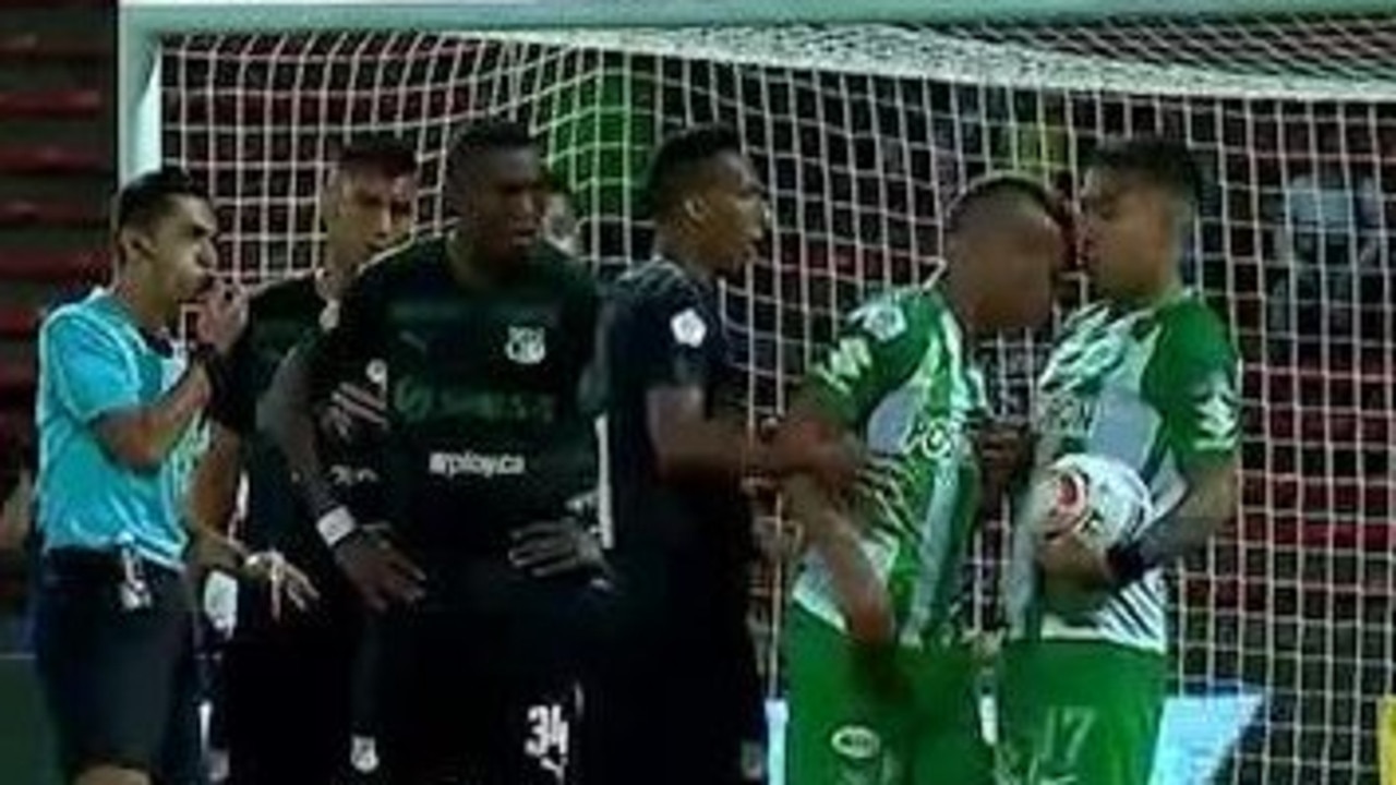 This was the shocking moment two players on the same team clashed over who should take a free-kick.