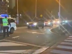 Cars have lined up on the Queensland border at Coolangatta after new restrictions came into effect. Picture: 9 News/Jess Millward