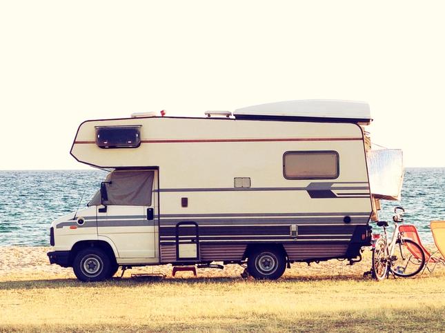 ESCAPE: Caravaning. A vintage shoot with a caravan car near the Mediterranean sea in a beautiful summer day. Copy space also. Picture: istock