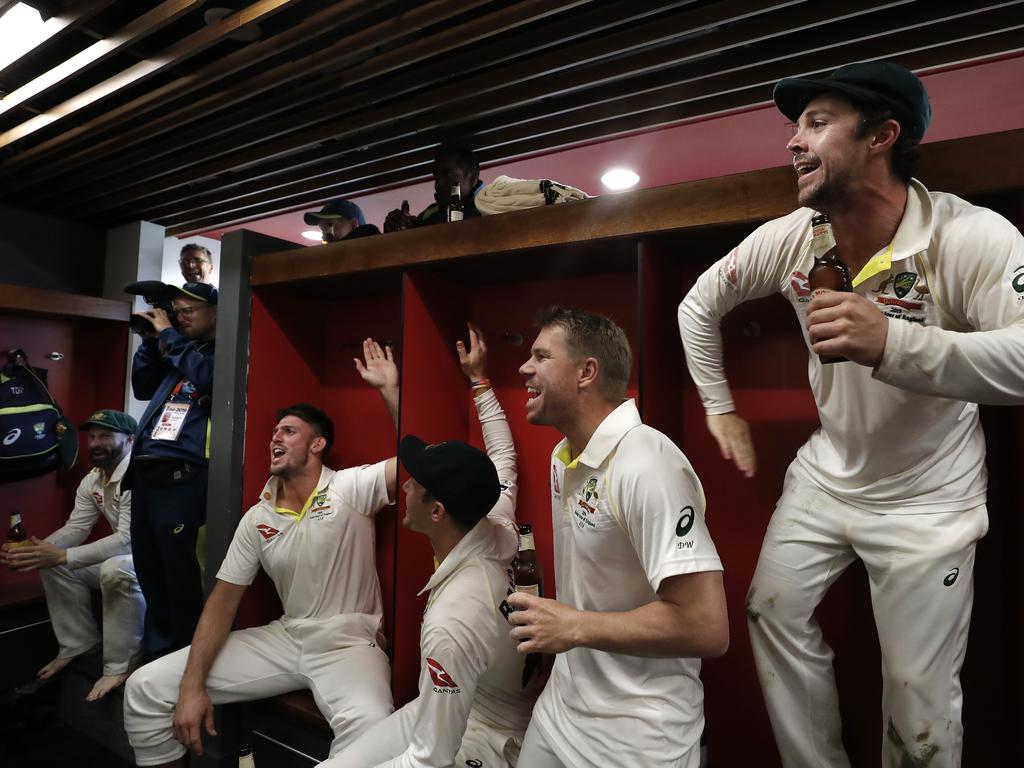 MANCHESTER, ENGLAND - SEPTEMBER 08: Mitch Marsh, David Warner and Travis Head of Australia celebrate in the change rooms after Australia claimed victory to retain the Ashes during day five of the 4th Specsavers Test between England and Australia at Old Trafford on September 08, 2019 in Manchester, England. (Photo by Ryan Pierse/Getty Images)