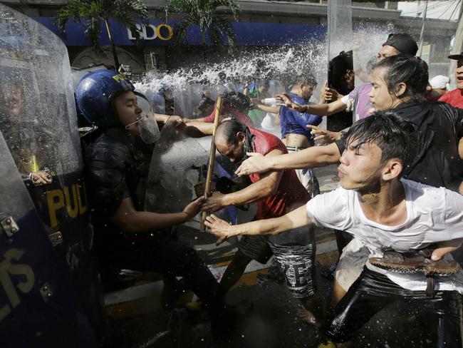 Protesters scuffle with police. Picture: AP