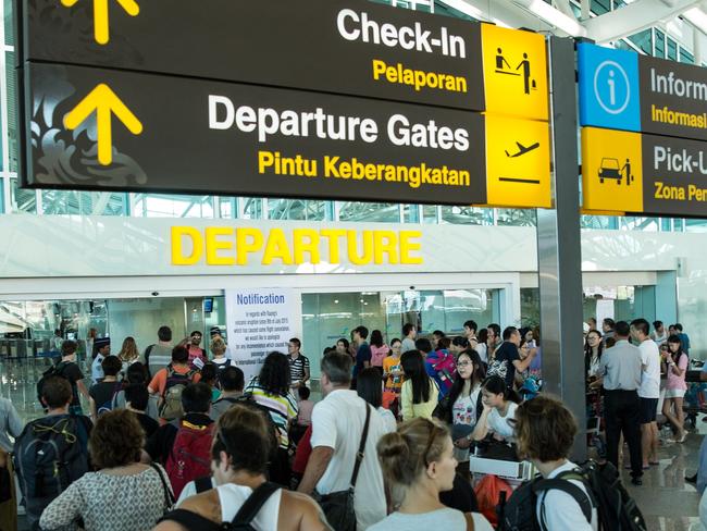 DENPASAR, BALI, INDONESIA - JULY 13:  Foreign tourists arrive at Ngurah Rai International airport departure on July 13, 2015 in Denpasar, Bali, Indonesia. Bali's international airport reopened after being closed due to volcanic ash clouds from Maunt Raung, but Australia's main carriers to the holiday destinations are still not flying. (Photo by Agung Parameswara/Getty Images)