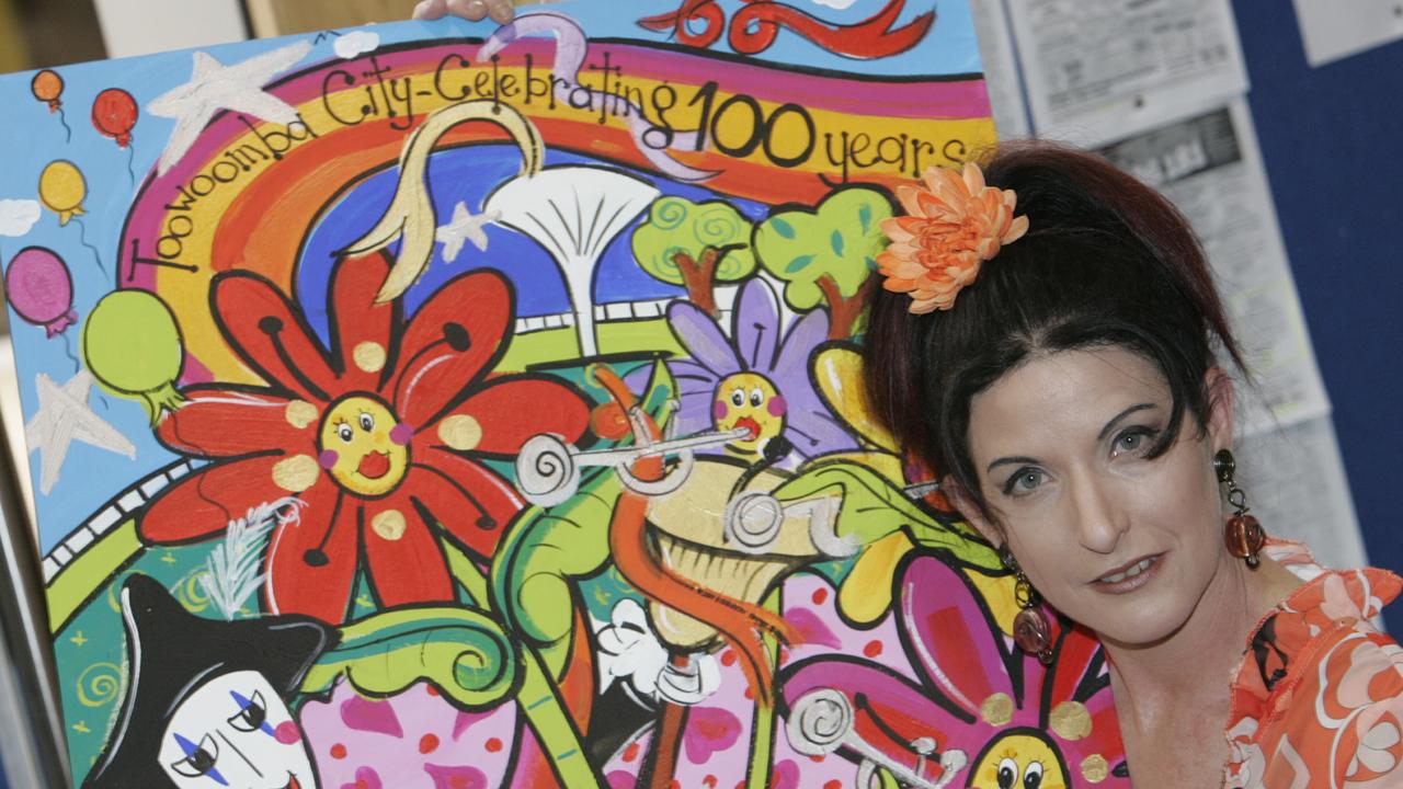 Kendall Perkins – Brakels with the artwork she created to celebrate 100 years of the Toowoomba carnival of flowers. Picture: Chris McCormack