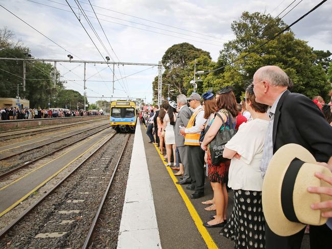 Racegoers wait for trains to return to the city after Melbourne Cup Day 2014 at Flemington Racecourse. Picture: Nathan Dyer