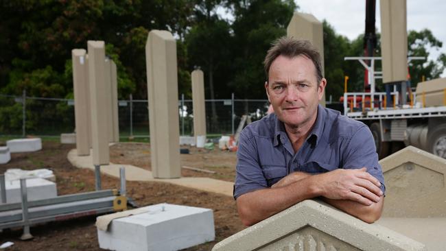 Samford RSL members who helped with the erection of the pillars in the Samford Avenue of Honour. Artist jamie Maclean, (Samford valley) with building work going on around him.