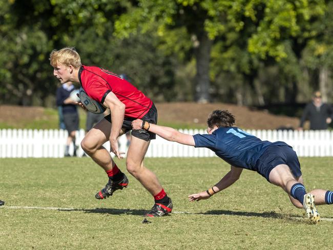 Angus Kelly is tackled in the GPS 1st XV Rugby game between Brisbane Grammar and Gregory Terrace at Northgate, Saturday, July 30, 2022 - Picture: Richard Walker