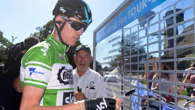 Chris Froome signs autographs on before stage three of the Jayco Herald Sun Tour.