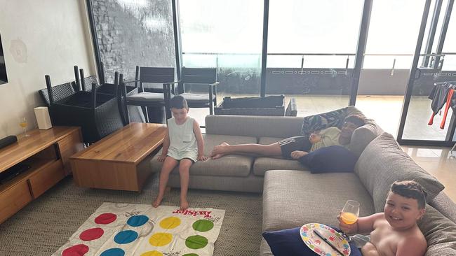 Damian, Katie, Andre, Danny, Luca, Milan and Paul Mandarano got stuck indoors during their holidays on Hamilton Island as tropical cyclone Kirrily is forecasted to land in Townsville on Thursday night. Picture: Katie Mandarano