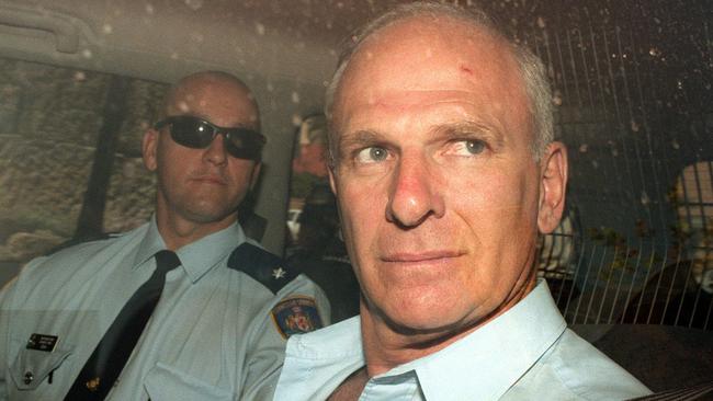 Arthur ‘Neddy’ Smith, guarded by correctional officers, leaves the Supreme Court on November 12, 1999.