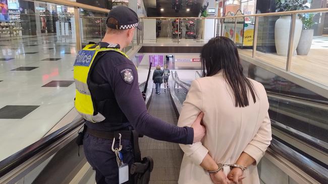 A woman is arrested by police as part of Operation Plymouth. Picture: Supplied