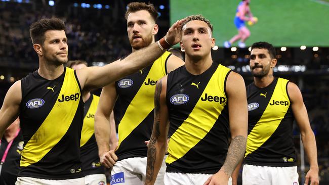 PERTH, AUSTRALIA - JUNE 13: Trent Cotchin of the Tigers consoles Shai Bolton while walking from the field after being defeated during the round 14 AFL match between the West Coast Eagles and the Richmond Tigers at Optus Stadium on June 13, 2021 in Perth, Australia. (Photo by Paul Kane/Getty Images)