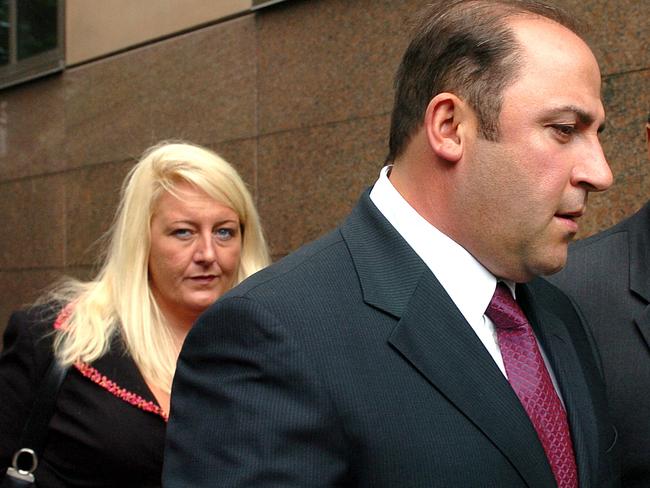 15 Nov 2004 : Gangland boss, Tony Mokbel with his legal team Nicola Gobbo (left) and Con Heliotis QC (right) outside the Magistrates Court - crime Vic drugs headshot mobile phone profile