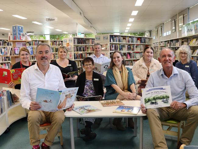 Clarence MP Chris Gulaptis  and Richmond Valley Mayor Robert Mustow surrounded by Casino Library staff.