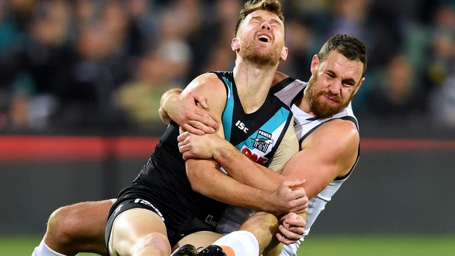 Robbie Gray is tackled without the ball by Shane Mumford. Picture: Getty Images