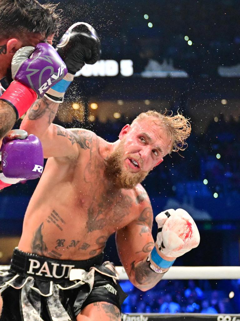 Jake Paul punches Mike Perry during their cruiserweight fight in July. Photo: Julio Aguilar/Getty Images/AFP.