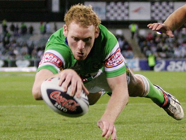 CANBERRA, AUSTRALIA - MARCH 29: Joel Monaghan of the Raiders beats the defence of Ben Hornby of the Dragons to score during the round three NRL match between the Canberra Raiders and the St George Illawarra Dragons at Canberra Stadium on March 29, 2008 in Canberra, Australia. (Photo by Mark Nolan/Getty Images)