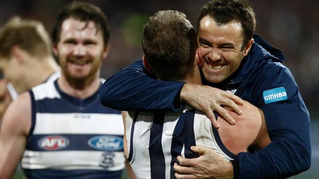 Chris Scott celebrates a win with Joel Selwood.