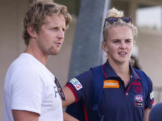 Shae Sloane of the Demons (right) and her brother Rory Sloane of the Adelaide Crows are seen after the Round 1 AFLW match between Melbourne and Fremantle at Casey Fields in Melbourne, Sunday, February 3, 2019. (AAP Image/Daniel Pockett) NO ARCHIVING, EDITORIAL USE ONLY