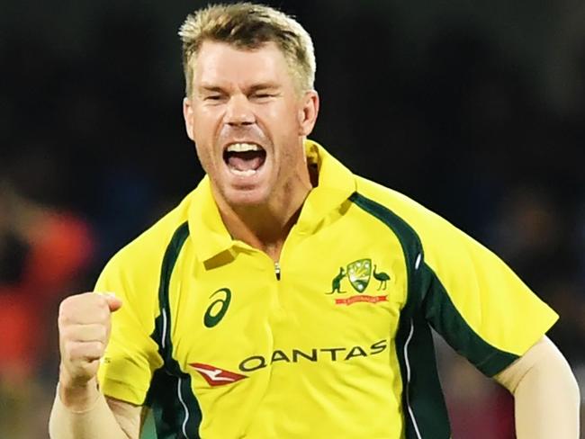 Australia's captain David Warner celebrates the wicket of India's Manish Pandey during the second T20 match of the India-Australia cricket series at the Assam Cricket Association stadium in Guwahati on October 10, 2017. / AFP PHOTO / Dibyangshu SARKAR / ----IMAGE RESTRICTED TO EDITORIAL USE - STRICTLY NO COMMERCIAL USE----- / GETTYOUT