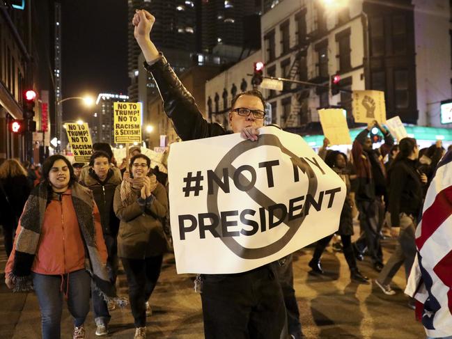 Protesters march North on State Street to express their disapproval of the election of Donald Trump as the 45th president of the United States on November 9, 2016 in Chicago. Picture: AP
