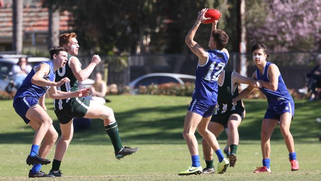 Sacred Heart’s Xavier Robins marks in front Westminster’s Will Wiseman. Picture: Russell Millard