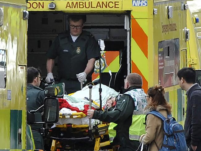 Paramedics load a victim into the back of an ambulance after the attack on Westminster. Picture: AFP