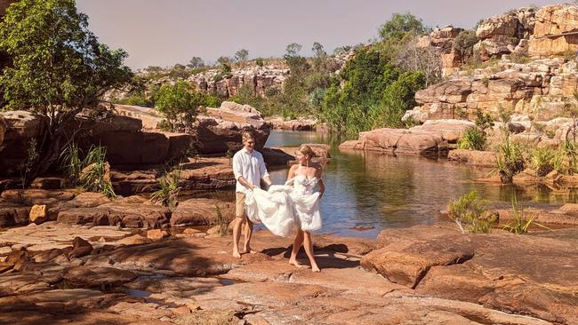 Jocelyn Ellero and Haydn Brown went to a remote part of the Kimberley for their honeymoon and asked chopper pilot Gareth to snap their photos. Picture: True North Helicopters