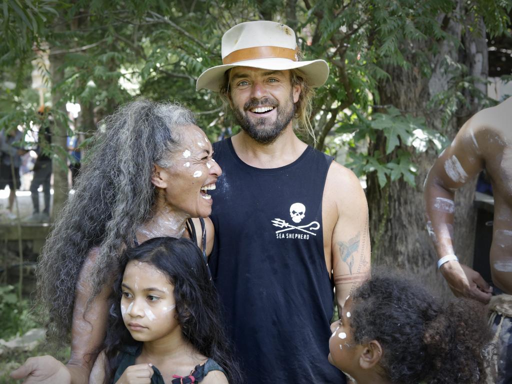 Members of the Jinibara emerging dance troupe with Xavier Rudd who came down to watch their performanceat the Woodford Folk Festival. Picture: Megan Slade/AAP