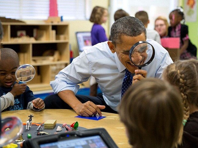 “President Barack Obama genuinely enjoys being with kids. Here, he played a magnifying glass game with children during a visit to a pre-kindergarten classroom at the College Heights Early Childhood Learning Center in Decatur, Georgia on February 14, 2013.” Picture: Pete Souza/The White House