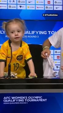 Matildas press conference gatecrashed by adorable visitor