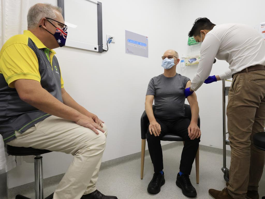 Prime Minister Scott Morrison looks on as chief medical officer Paul Kelly gets his Covid-19 vaccination in February, 2021. Picture: Getty Images