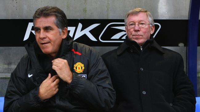 Sir Alex Ferguson of Manchester United looks on next to his assistant Carlos Queiroz.