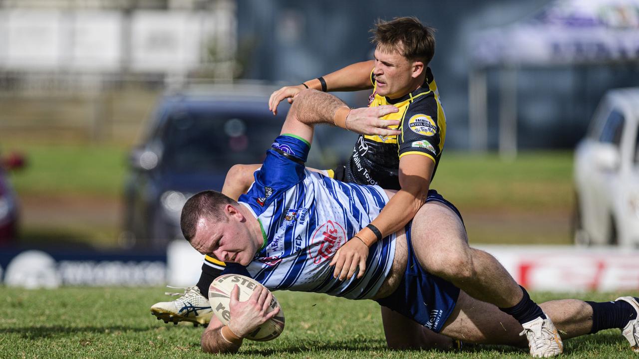 Gatton’s Thomas Luhrmann tackles Lachlan Kennedy of Brothers. Luhrmann currently leads the Webcke Price Medal race. Picture: Kevin Farmer