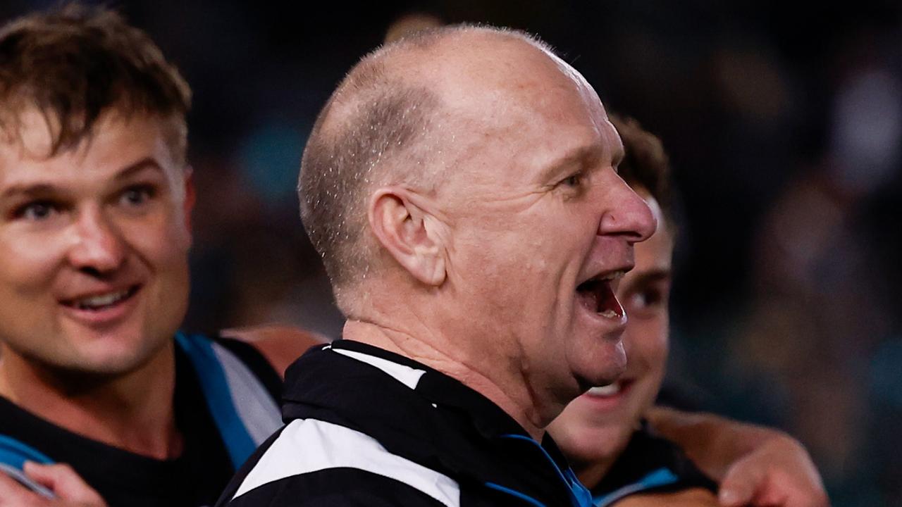 ADELAIDE, AUSTRALIA - SEPTEMBER 13: Ken Hinkley, Senior Coach of the Power exchanges words with Hawthorn players after the 2024 AFL Second Semi Final match between the Port Adelaide Power and the Hawthorn Hawks at Adelaide Oval on September 13, 2024 in Adelaide, Australia. (Photo by Michael Willson/AFL Photos via Getty Images)