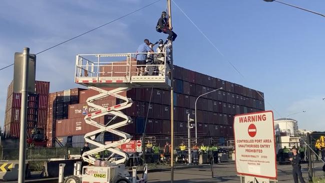 A cherry picker was used to bring the protester down. Picture: 7News Sydney