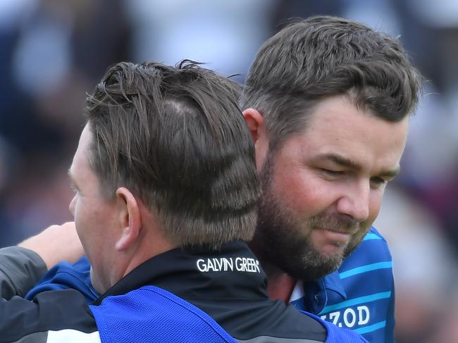 SAN DIEGO, CALIFORNIA - JANUARY 26: Marc Leishman of Australia reacts to his putt on the 18th green with his caddie Matt Kelly during the final round of the Farmers Insurance Open at Torrey Pines South on January 26, 2020 in San Diego, California. (Photo by Donald Miralle/Getty Images)