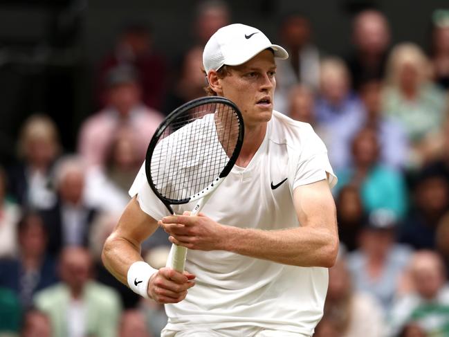 LONDON, ENGLAND - JULY 09: Jannik Sinner of Italy plays a backhand against Daniil Medvedev in the Gentlemen's Singles Quarter Final match during day nine of The Championships Wimbledon 2024 at All England Lawn Tennis and Croquet Club on July 09, 2024 in London, England. (Photo by Francois Nel/Getty Images)