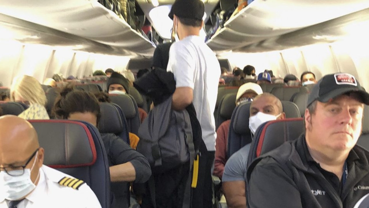 Airline passenger describes packed flight to NYC surrounded by people ...