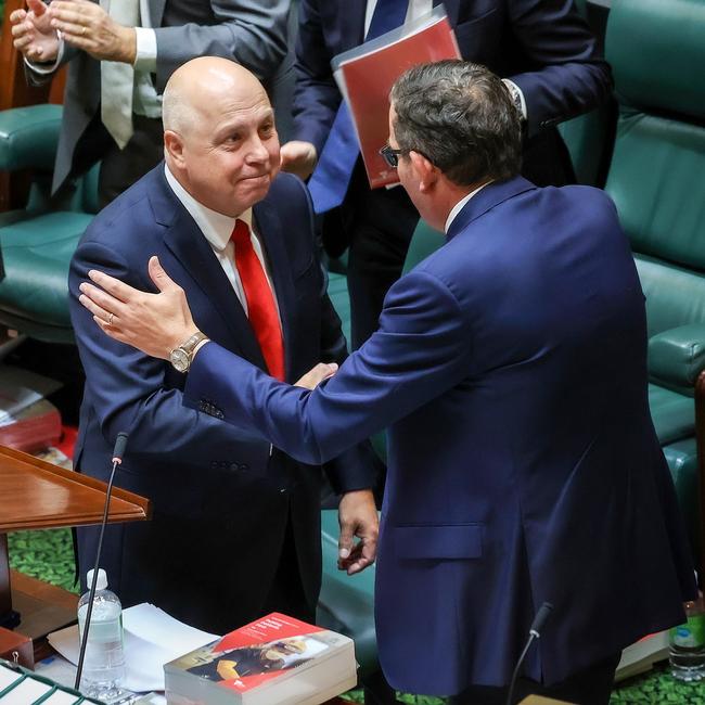 Premier Dan Andrews, right, congratulates Tim Pallas after delivering the budget on Tuesday. Picture: Ian Currie