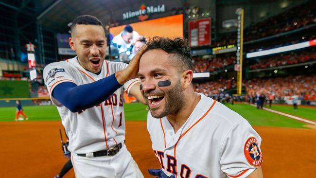 Jose Altuve and Carlos Correa of the Houston Astros celebrate victory over the New York Yankees to win the American League Championship Series in October. Picture: AFP